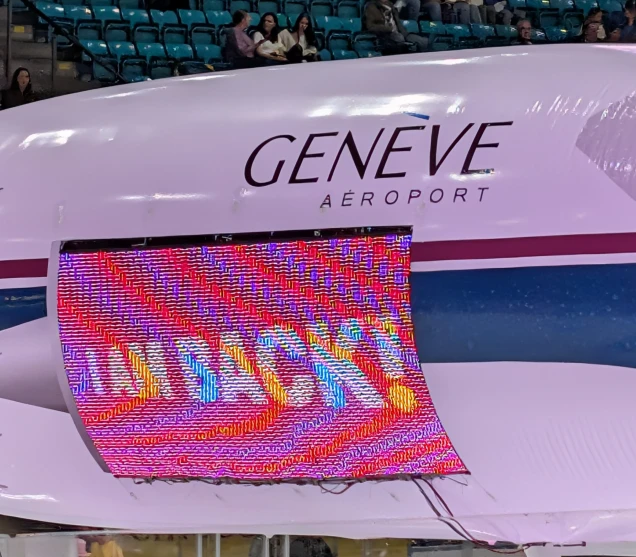 A close-up of the bright 128x64 video display used for drone advertising.