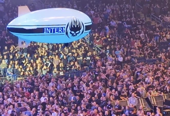 A live picture of our indoor blimp with an LED sign flying over a live crowd at a real concert, demonstrating indoor aerial advertising.