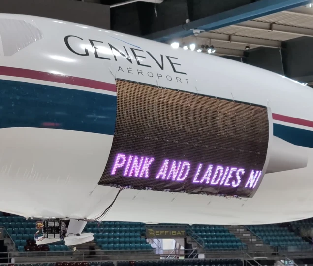 A flying billboard displaying dynamic text overlays for a drone advertising campaign.